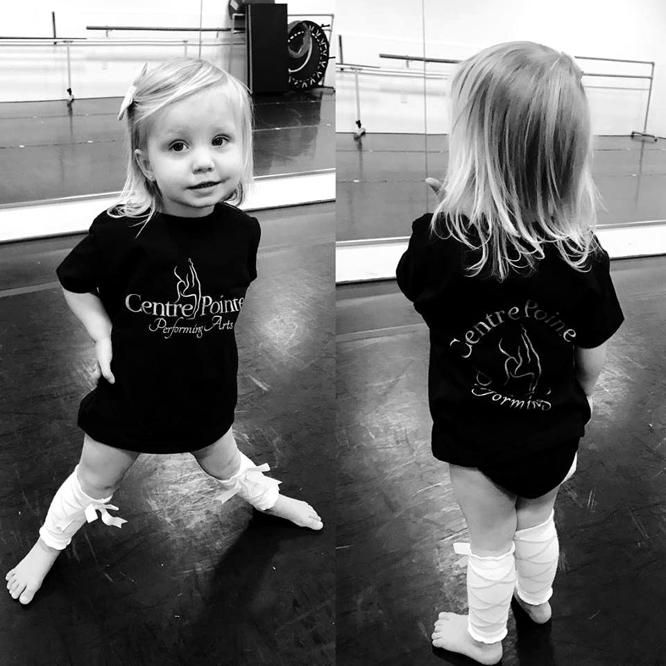 A toddler in a Centre Pointe T-shirt, shown from the front and the back