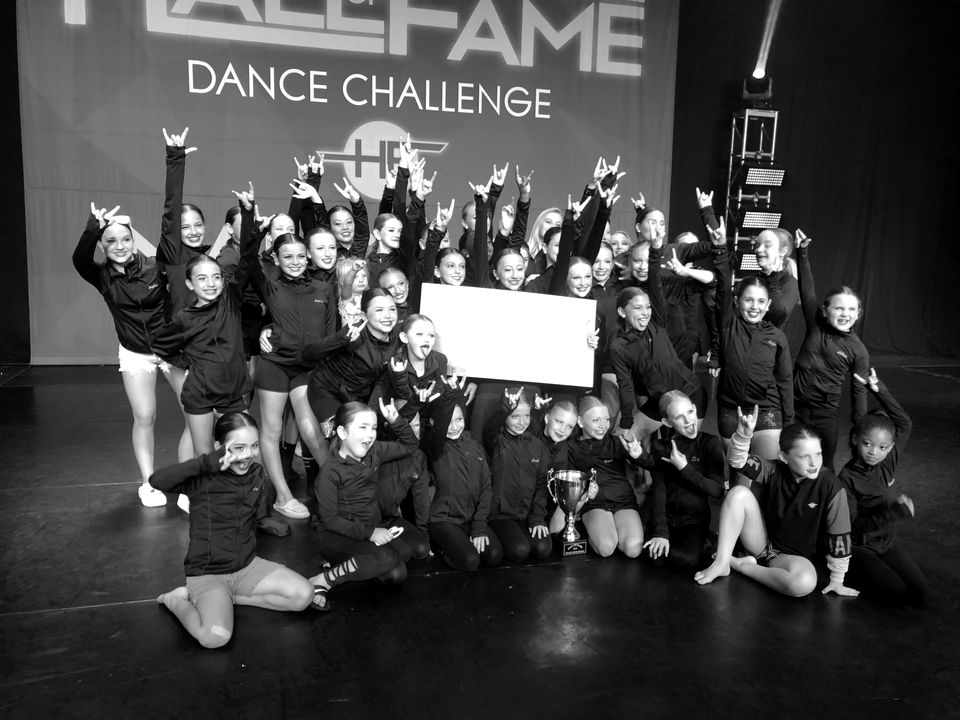 The Centre Pointe team celebrating on stage at the Hall of Fame Dance Challenge