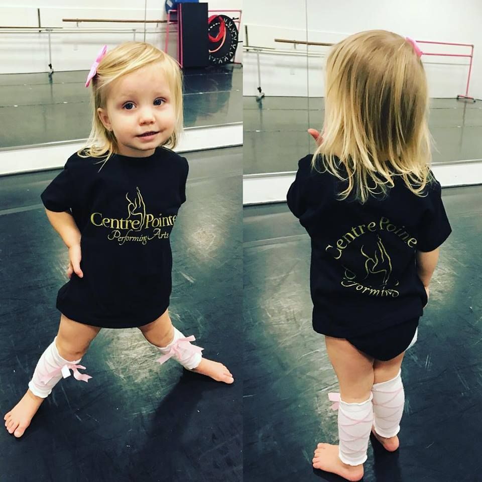 A toddler in a Centre Pointe T-shirt, shown from the front and the back