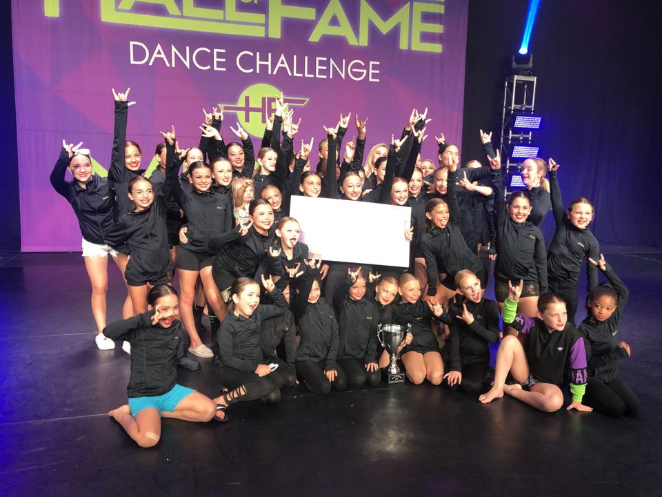 The Centre Pointe team celebrating on stage at the Hall of Fame Dance Challenge